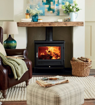 Chesneys Salisbury 12WS Wood Burning Stove shown in a cottage-style home with timber beam