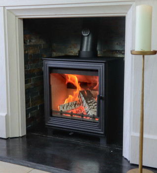 Woodford Pankhurst L Wood Burning Stove - Shown with a Durrington limestone surround and black hearth