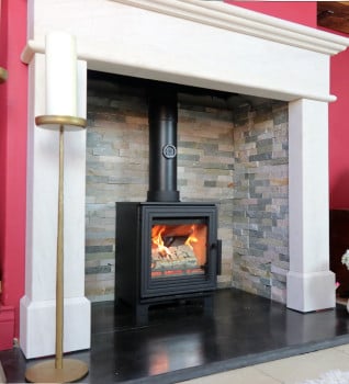 Woodford Pankhurst S Wood Burning Stove - Shown in a chimney breast with smooth finished chamber