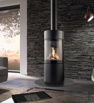 Dru Passo BF Gas Stove in Nero shown against a modern waterfall black slate wall